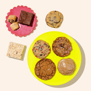 colorful plates with assorted holiday cookies on display